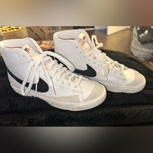 Women’s Nike White and Black High-Top Sneakers